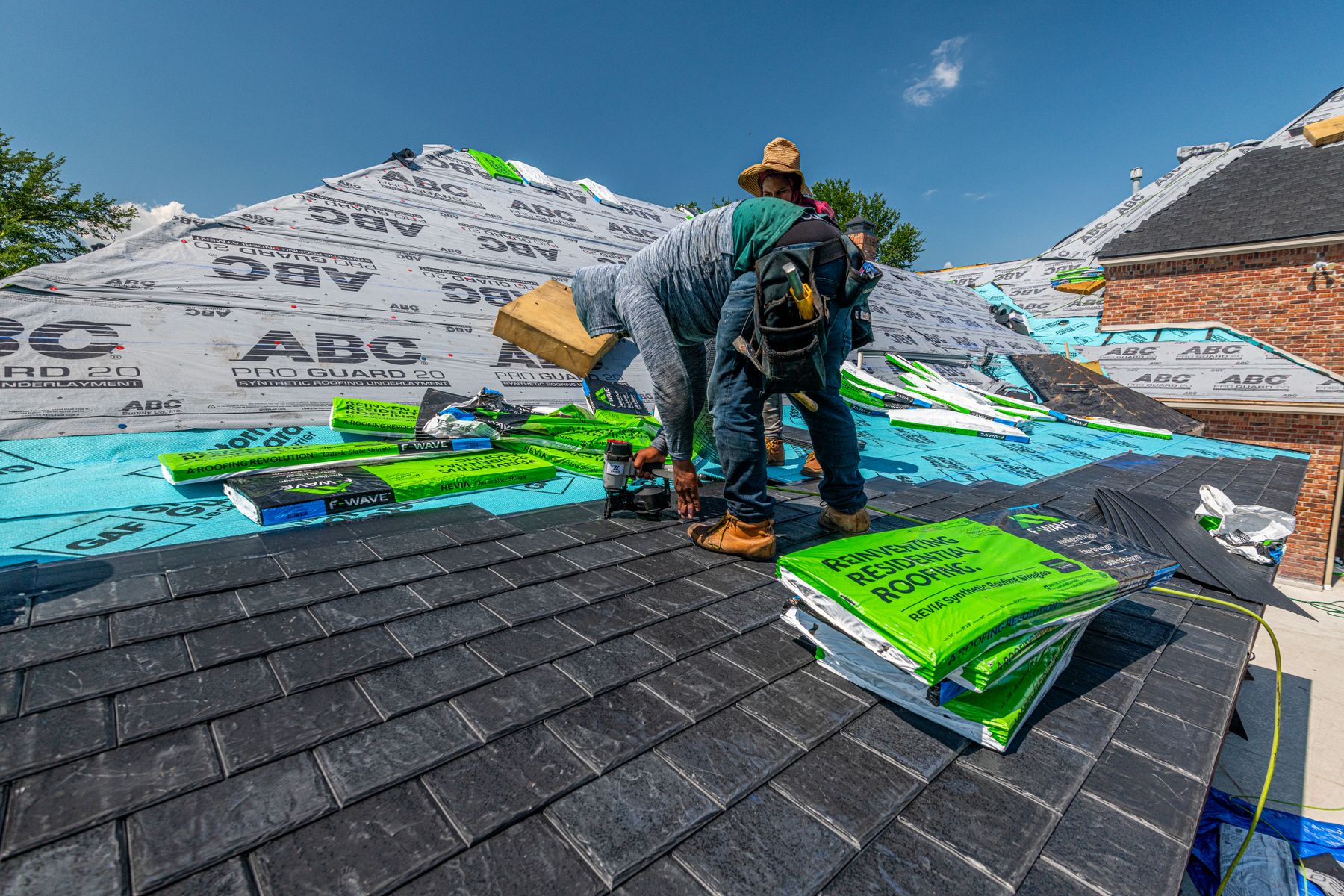 The same roof section after a targeted repair, new flashing and shingles blended in